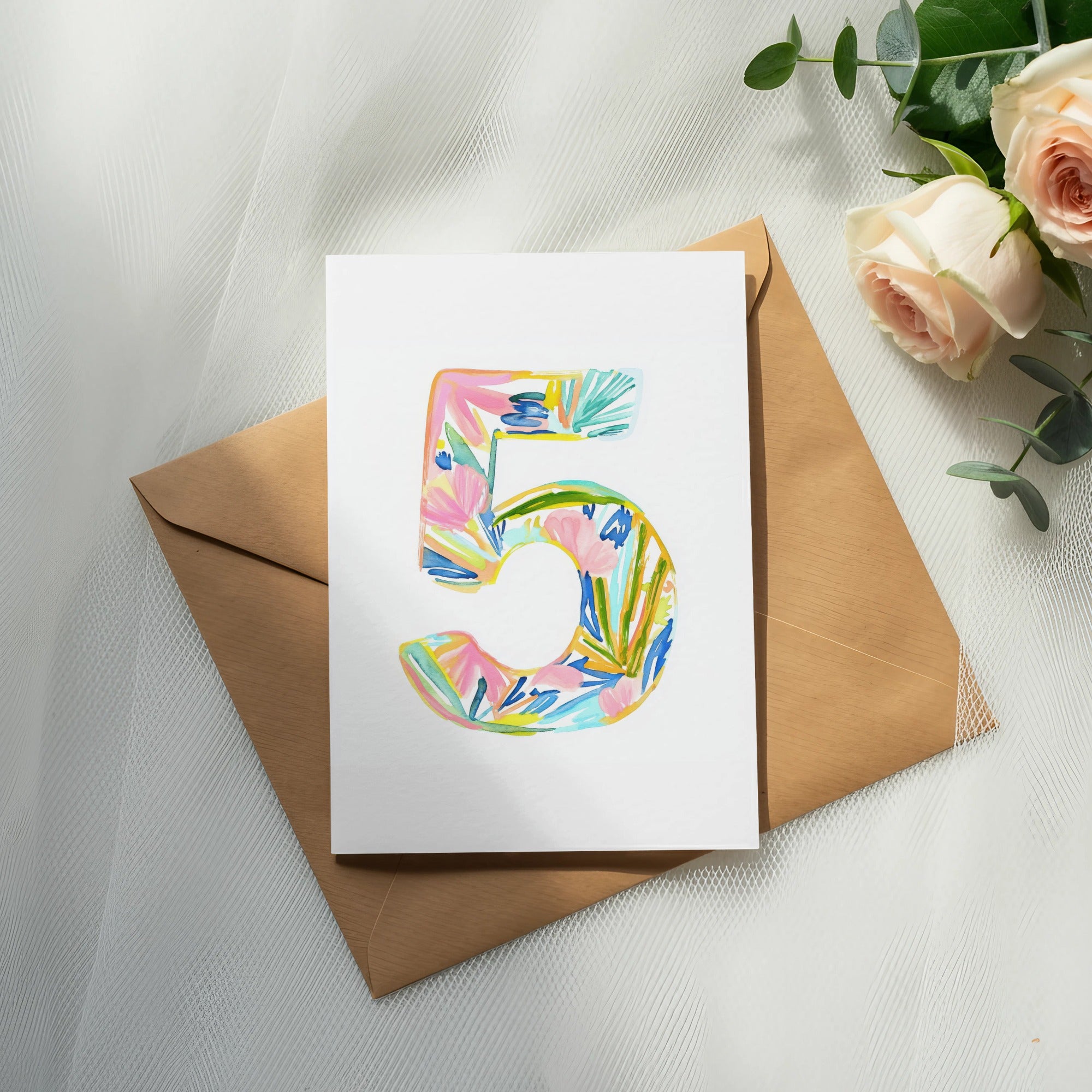 Card with watercolor number five and floral design on brown envelope.