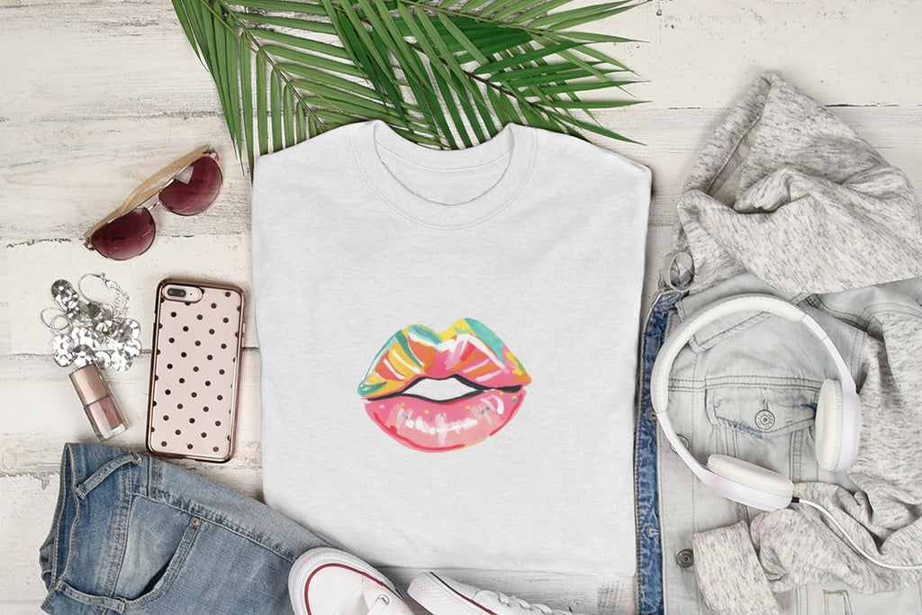 White t-shirt with colorful lips graphic, sunglasses, and headphones.