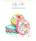 Watercolor macarons with floral designs in yellow, pink, and mint green.