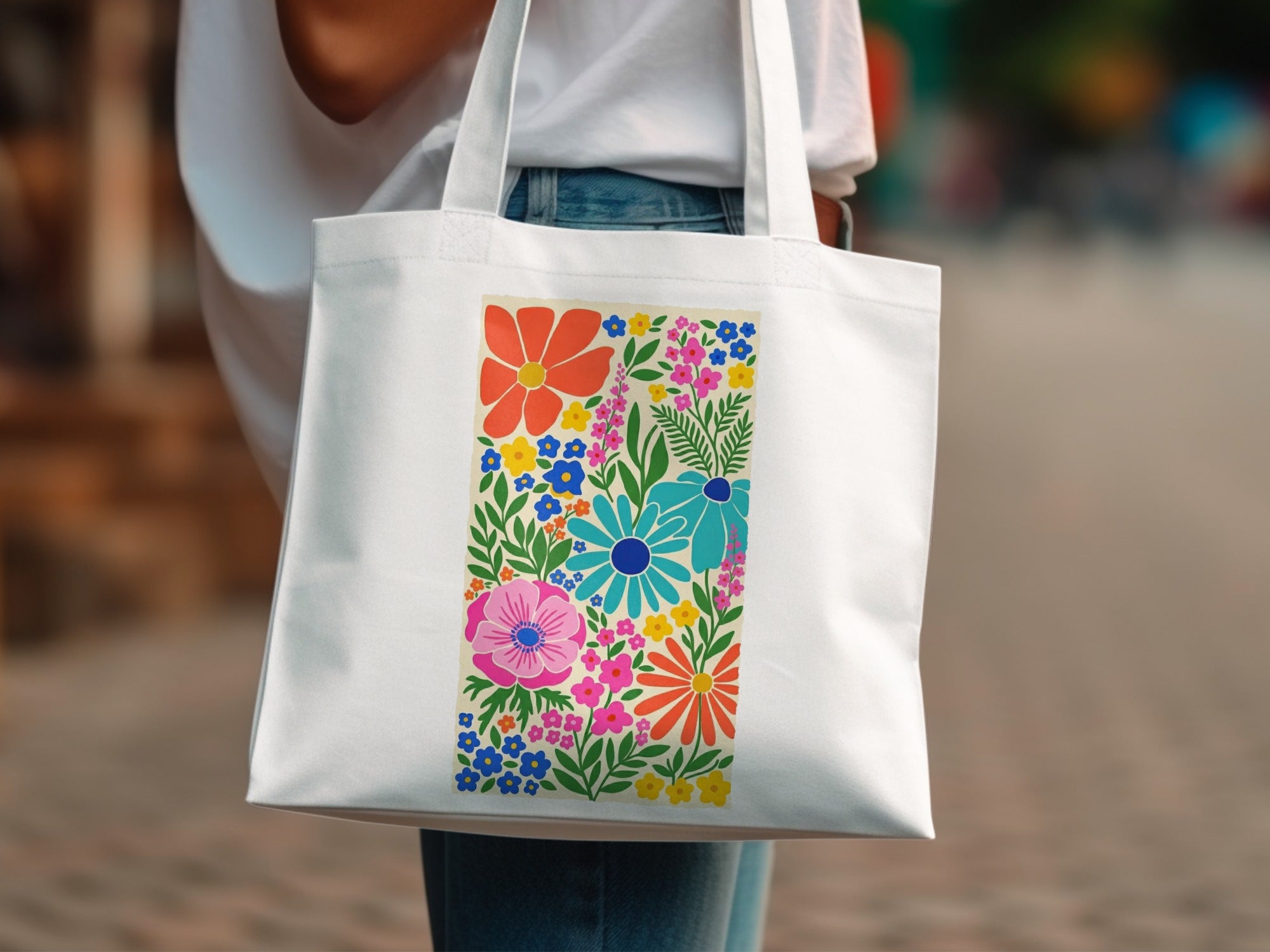 White tote bag with colorful floral pattern.