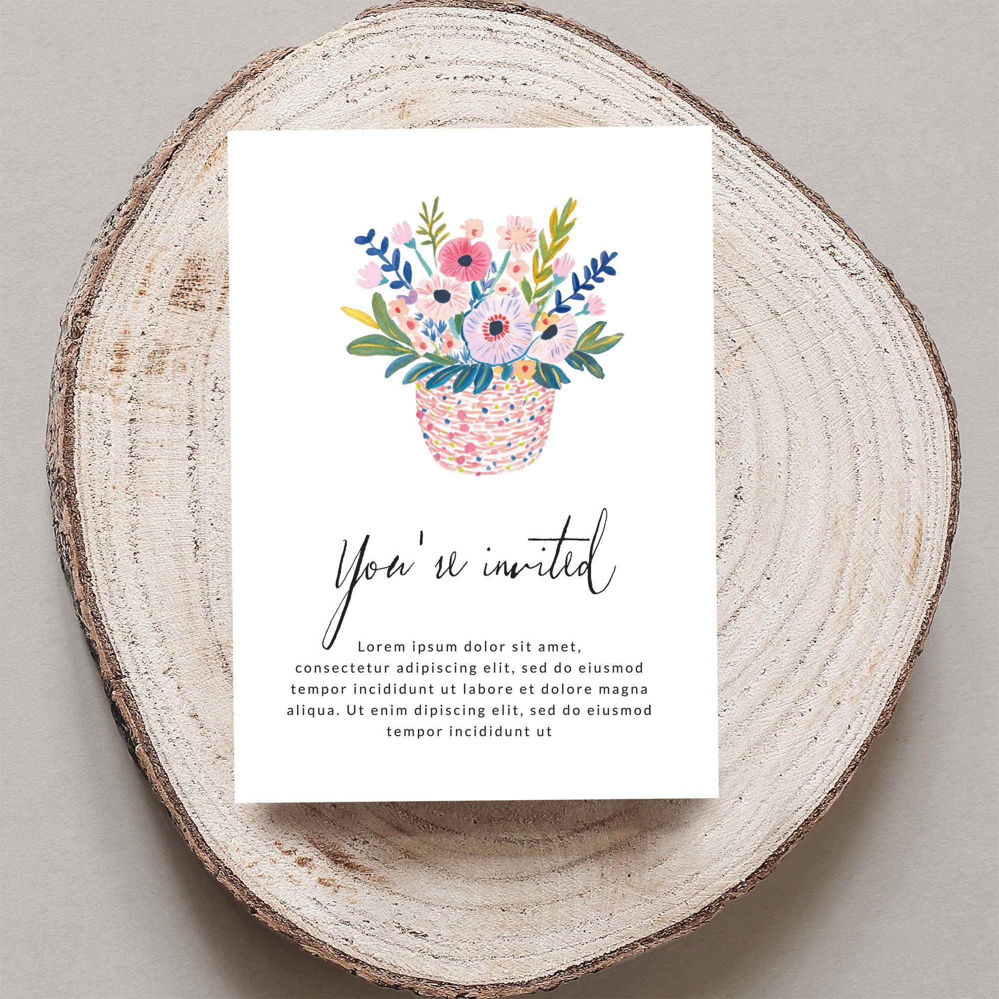 Invitation with floral basket illustration and placeholder text.