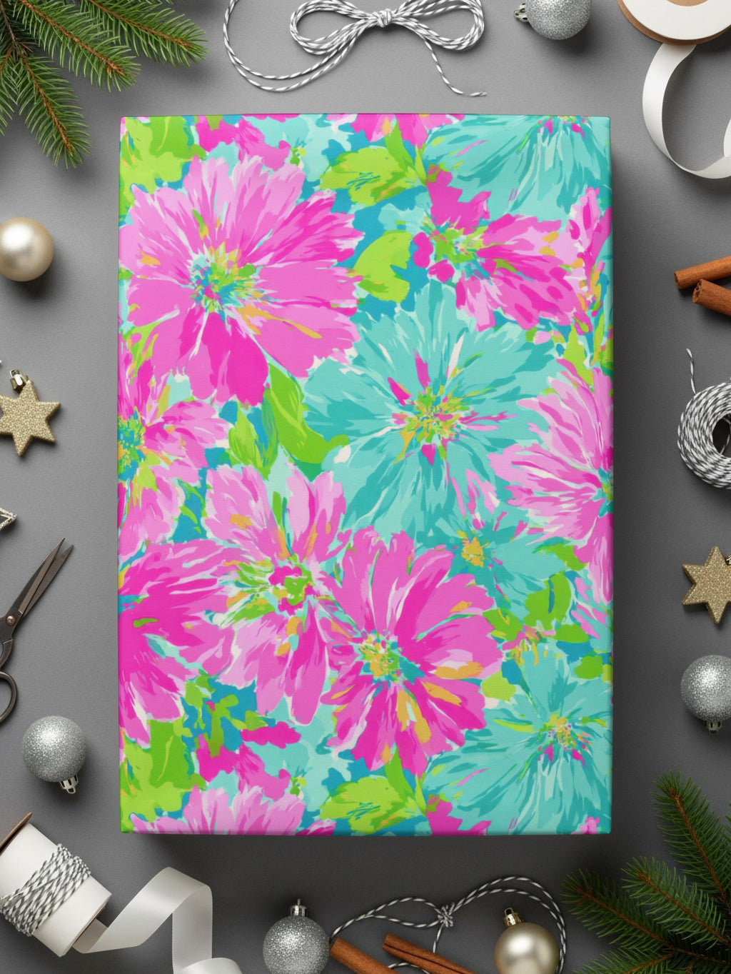 Bright pink and turquoise floral wrapping paper with metallic star ornaments.