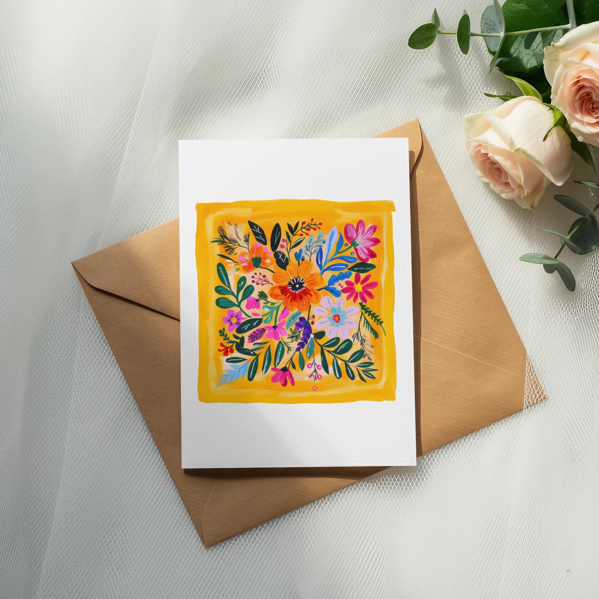 Floral illustration on a white card atop a brown envelope.