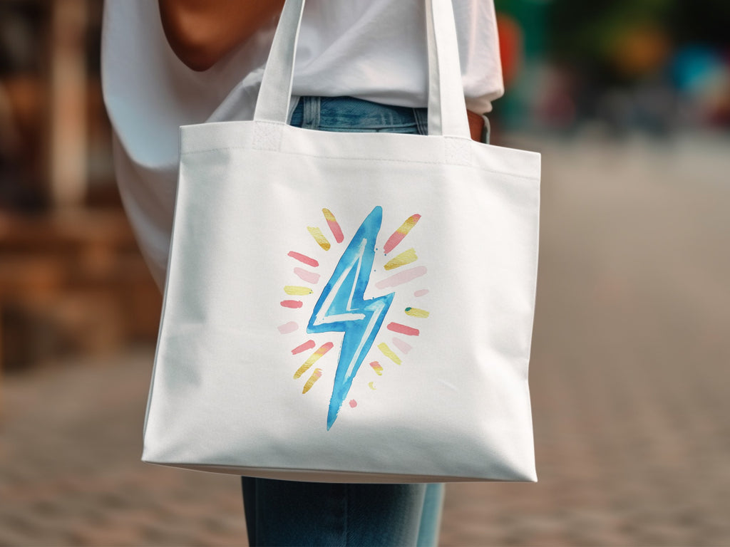 White canvas tote bag with a watercolor lightning bolt graphic.