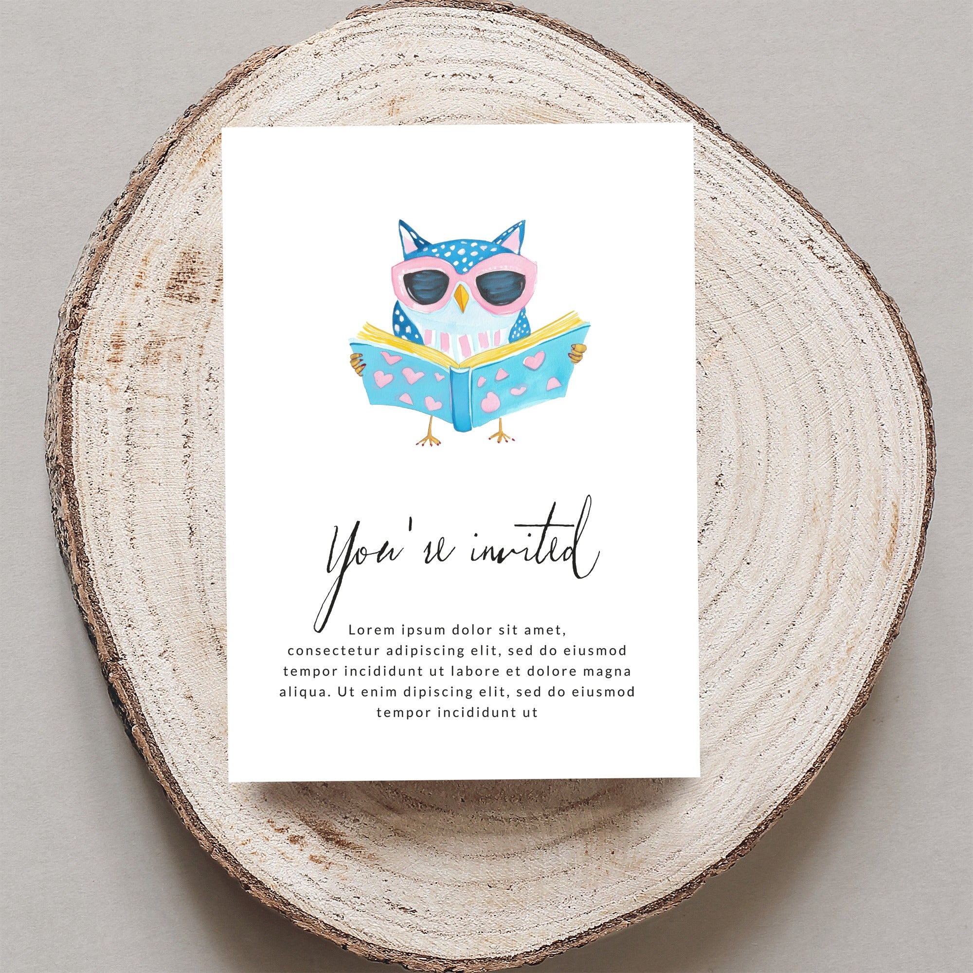 Invitation with watercolor owl reading a book, "You're invited" text.