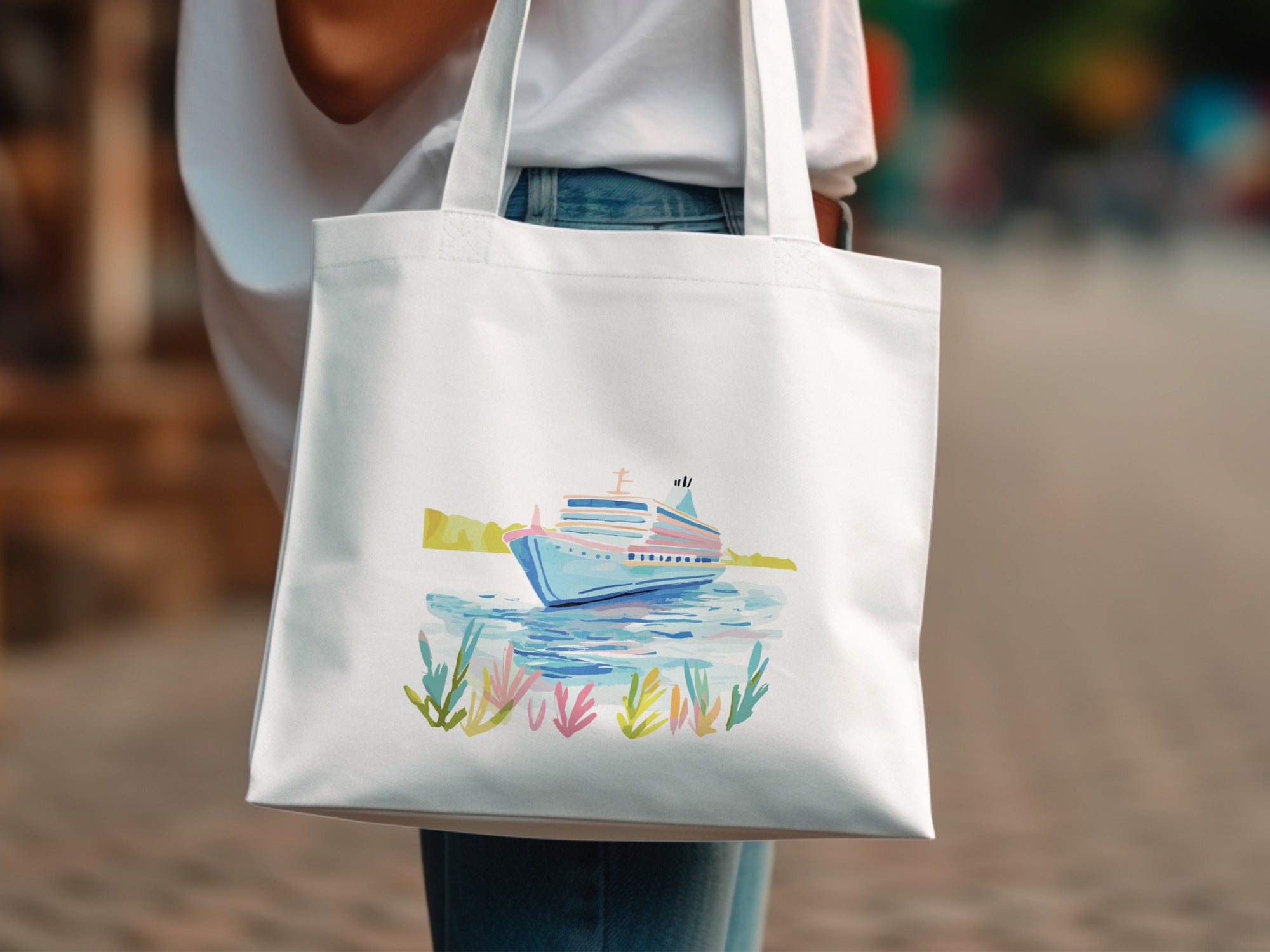 White tote bag with watercolor illustration of a cruise ship on water.