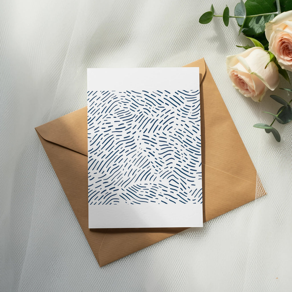 Card with blue abstract pattern on brown envelope and roses.