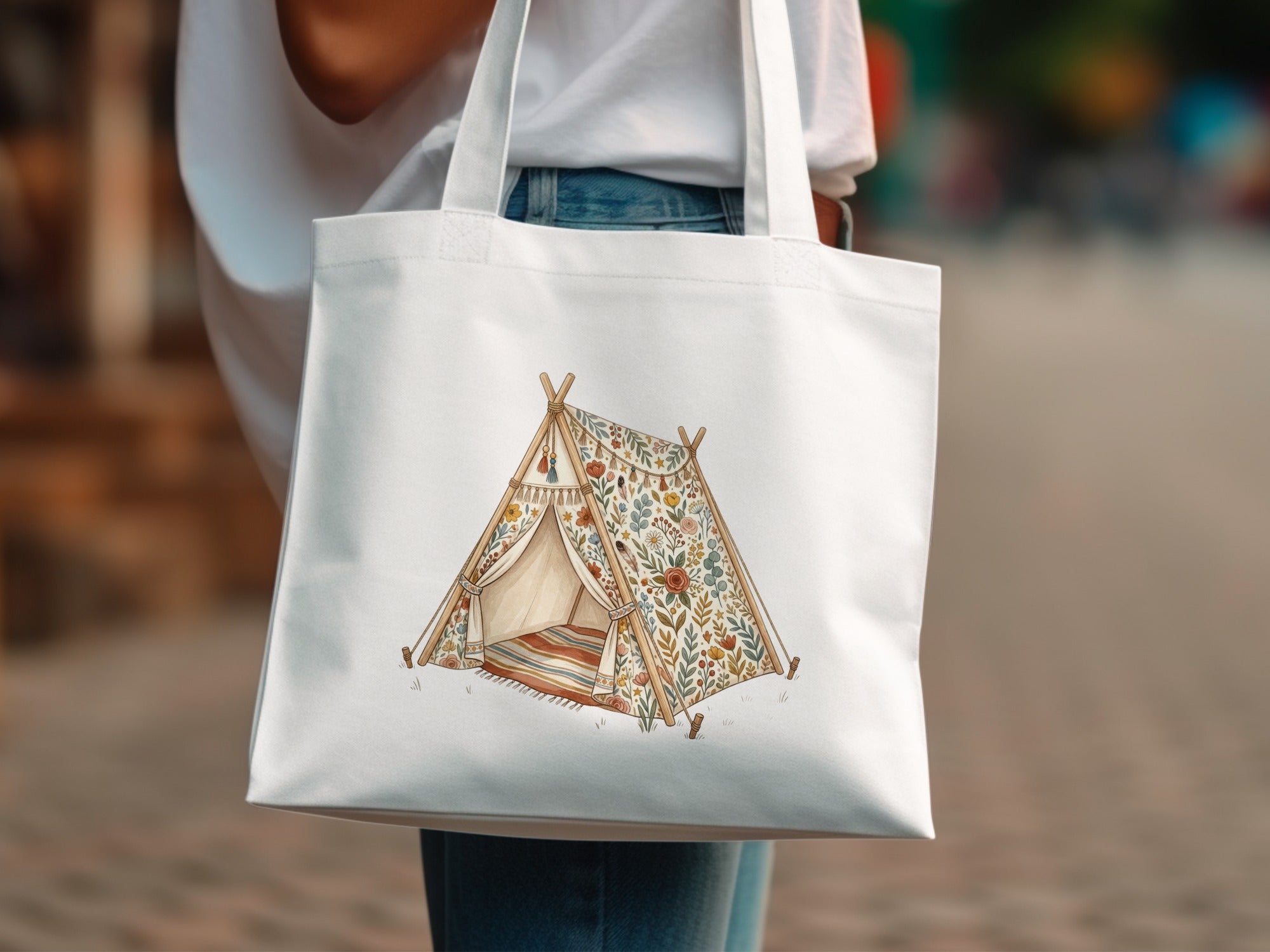 White tote bag with floral teepee illustration.
