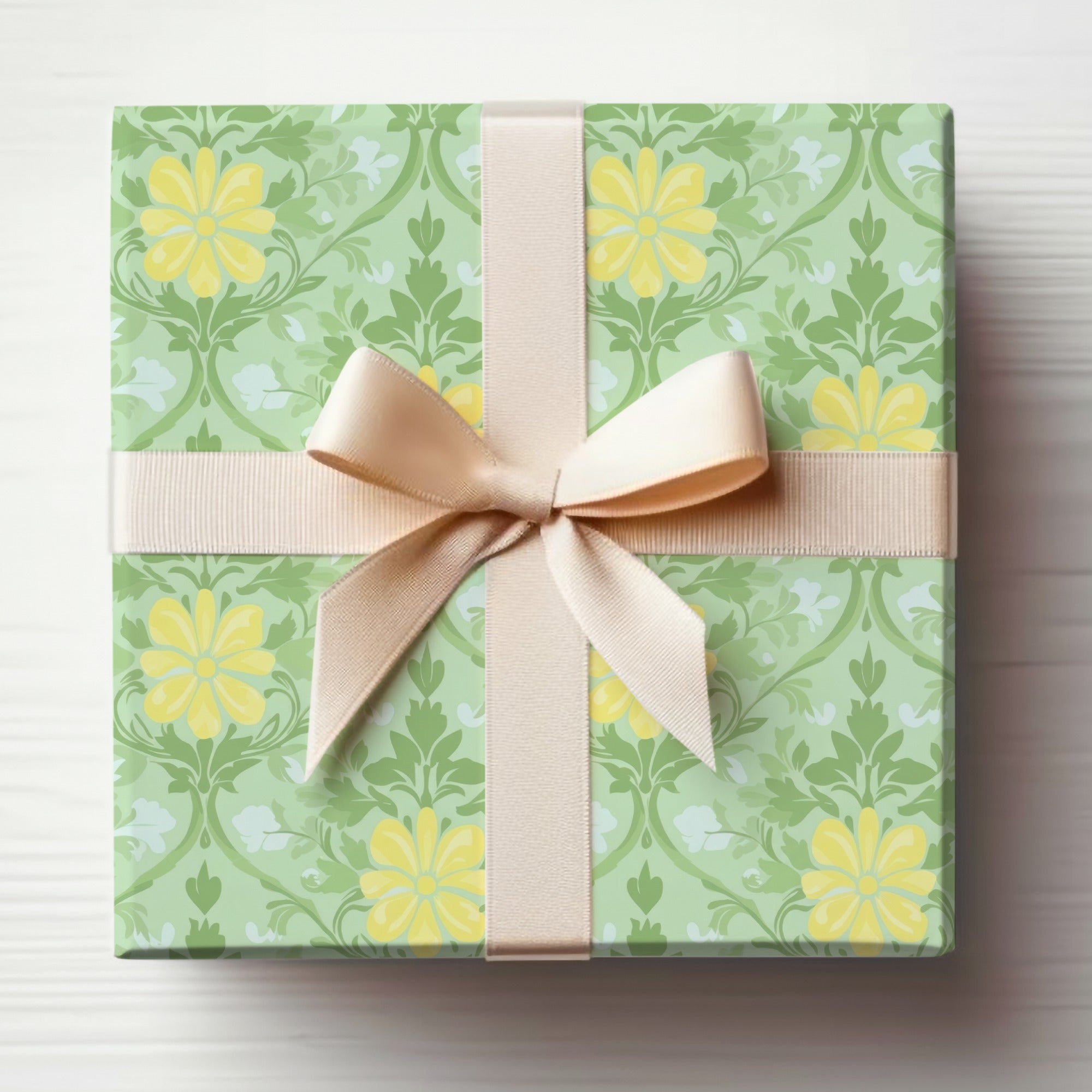 Green gift wrap with yellow floral pattern and beige ribbon bow.