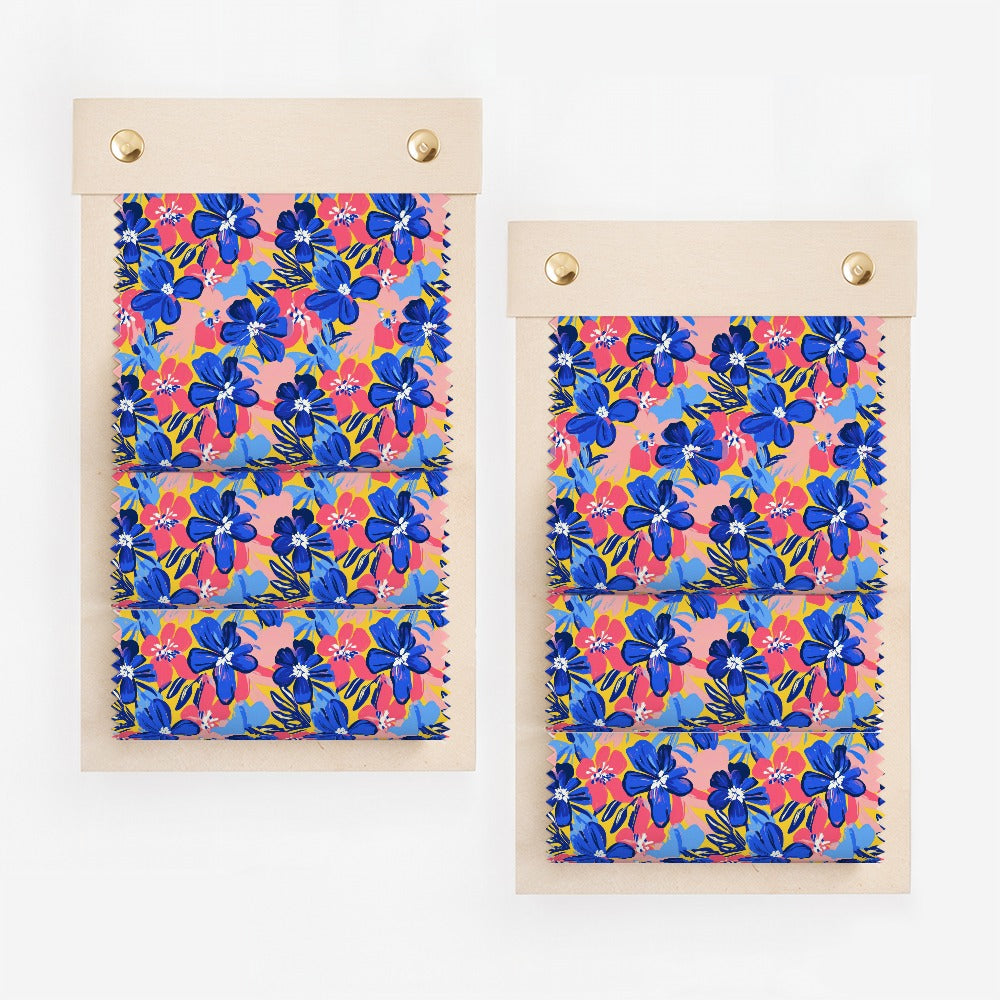 Two swatch displays of fabric with a blue and pink floral pattern.