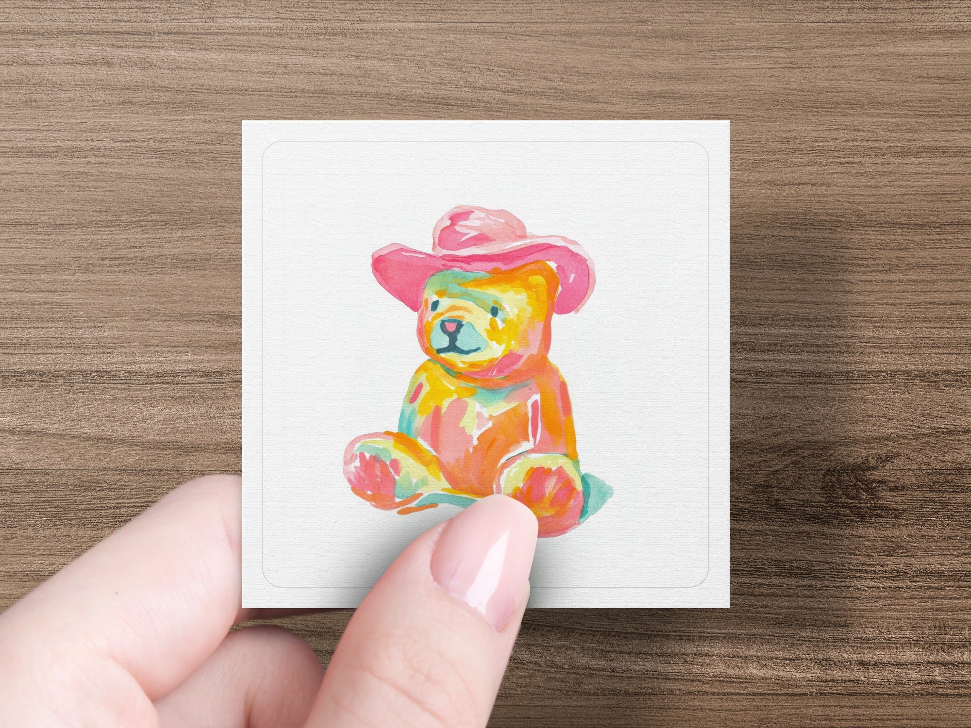 Watercolor teddy bear in a pink hat.