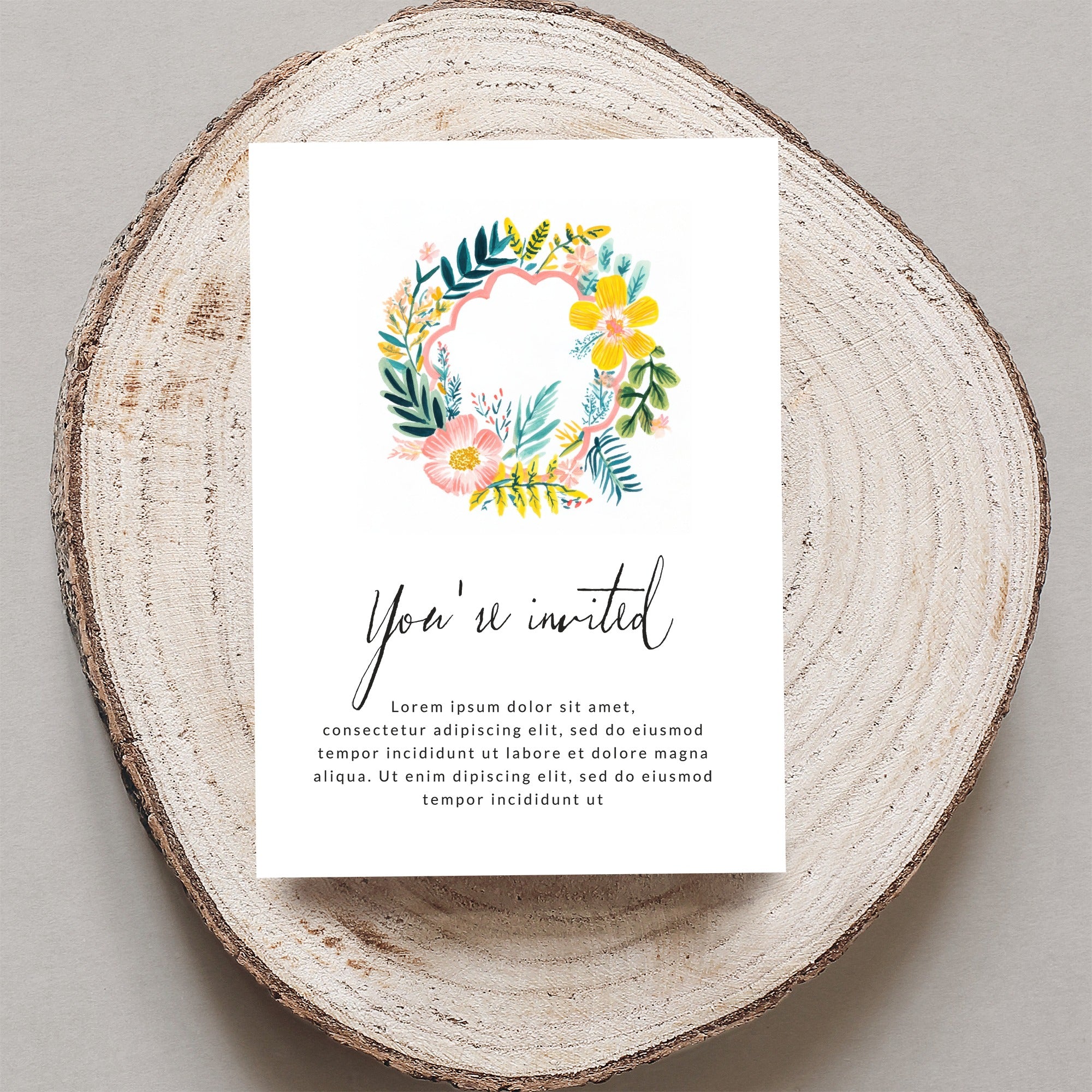 Floral wreath invitation with "You're invited" text and placeholder copy.