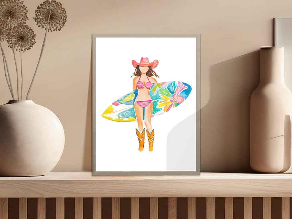 Cowgirl with surfboard and pink bikini standing on beach.