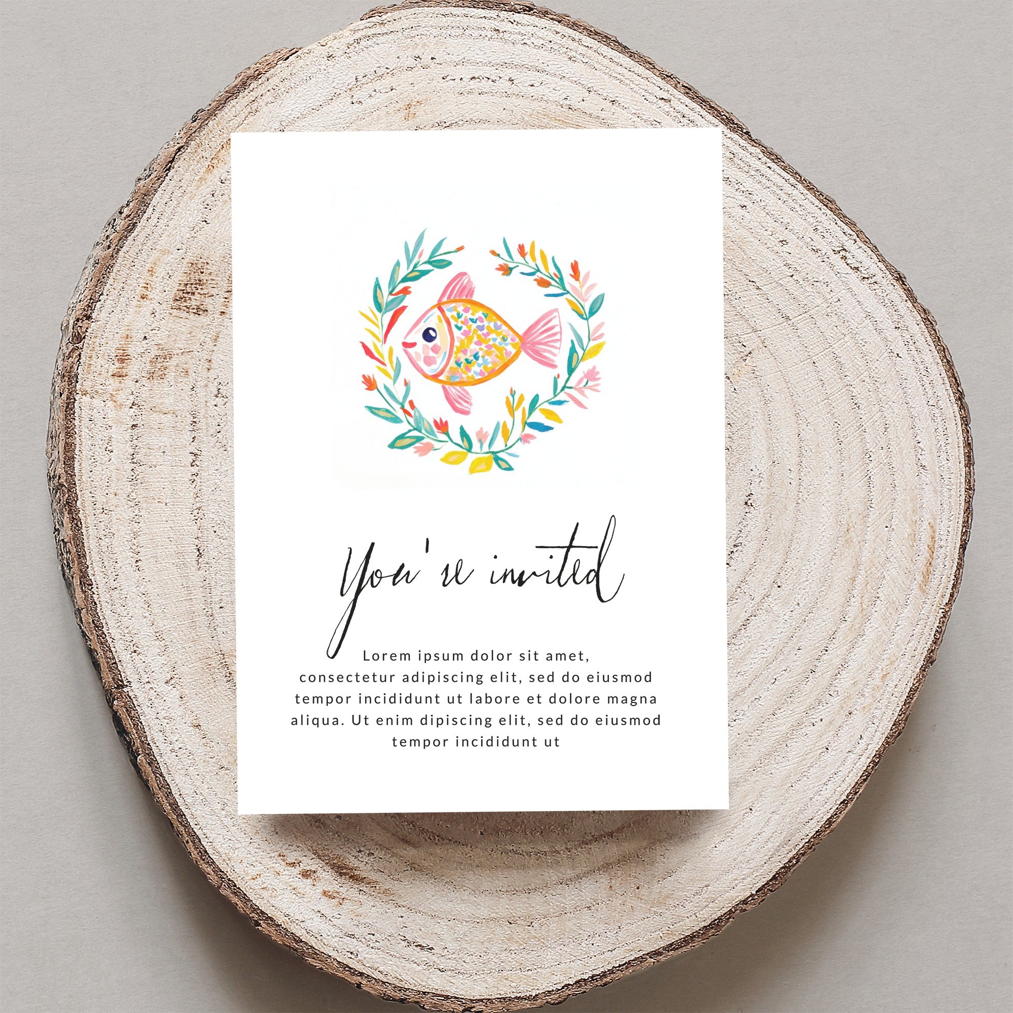 Invitation with floral wreath and fish, "You're invited" text.