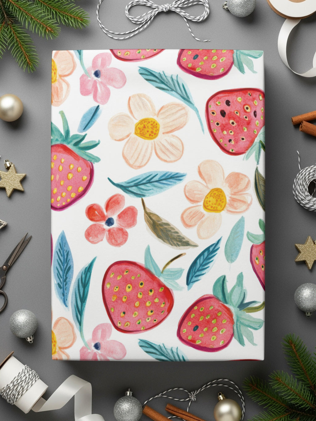 Wrapping paper with strawberries and pink and yellow flowers.