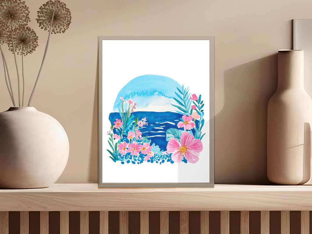 Watercolor painting of tropical flowers and ocean under a blue sun.