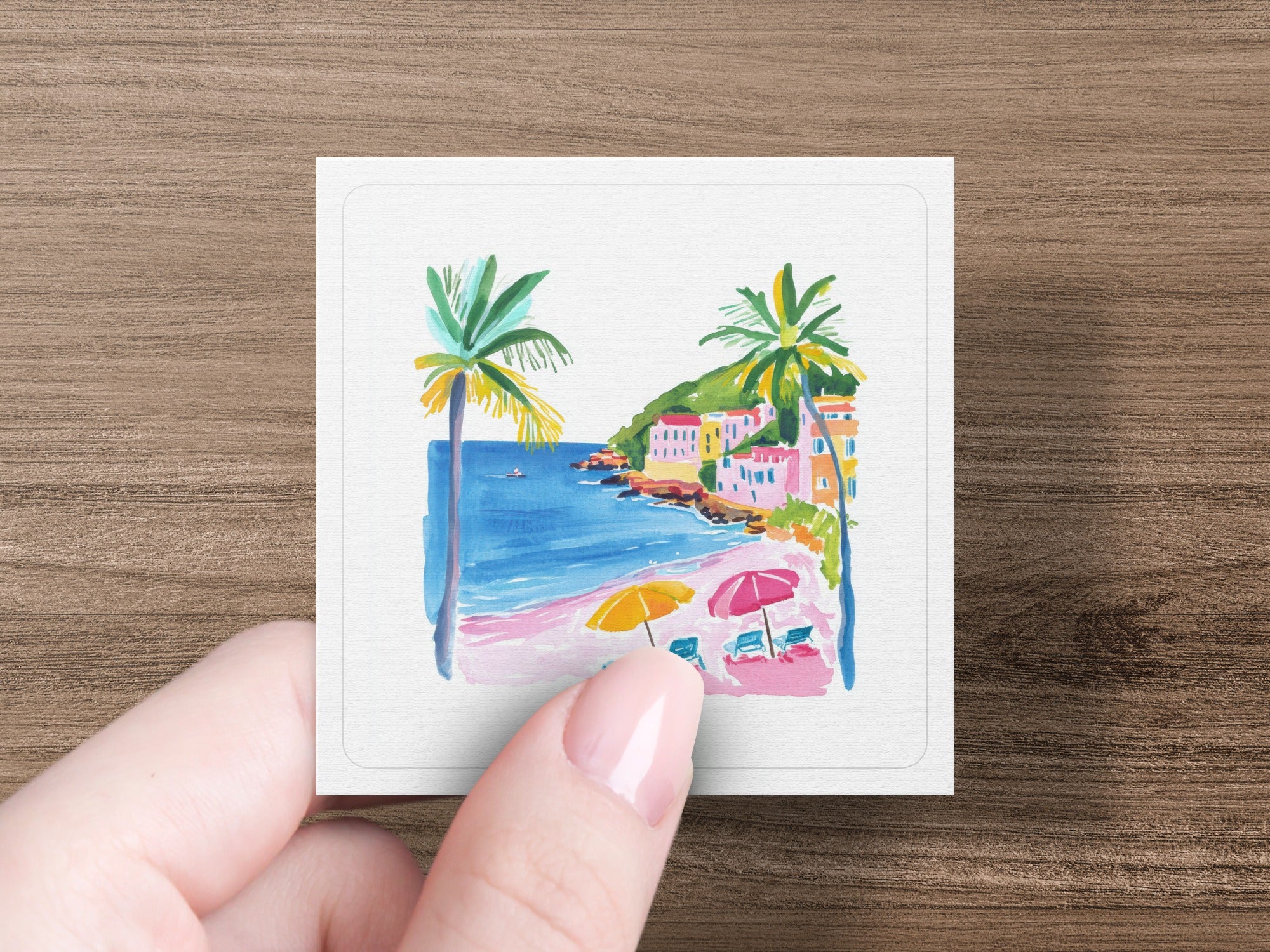 Watercolor beach scene with palm trees, umbrellas, and buildings.