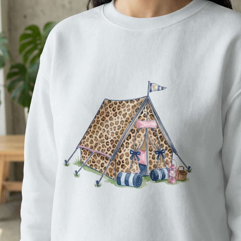Leopard print tent with sleeping bags and lanterns.