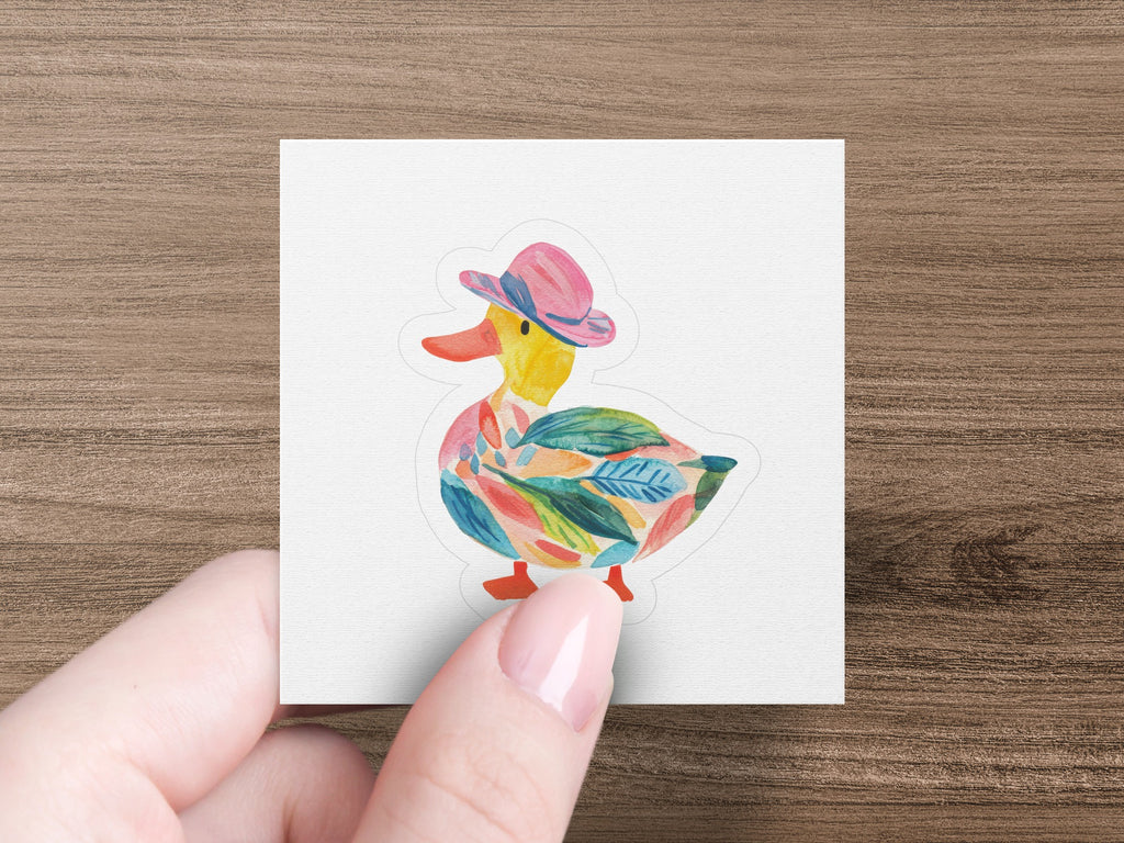 Duck sticker with colorful leaf pattern on hat and body.