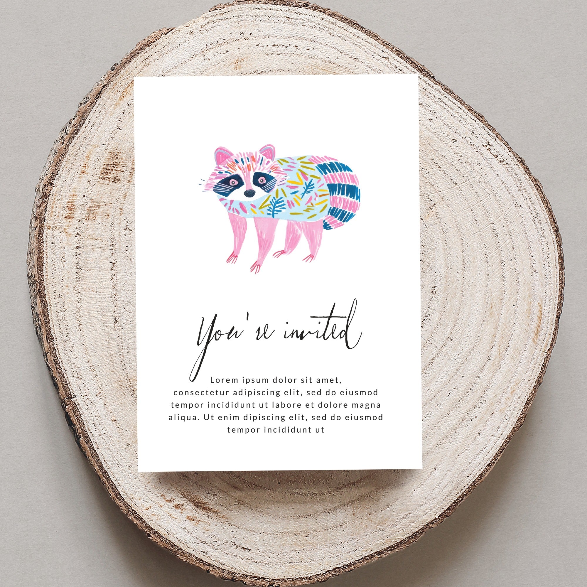 Invitation with watercolor raccoon and "You're invited" text.