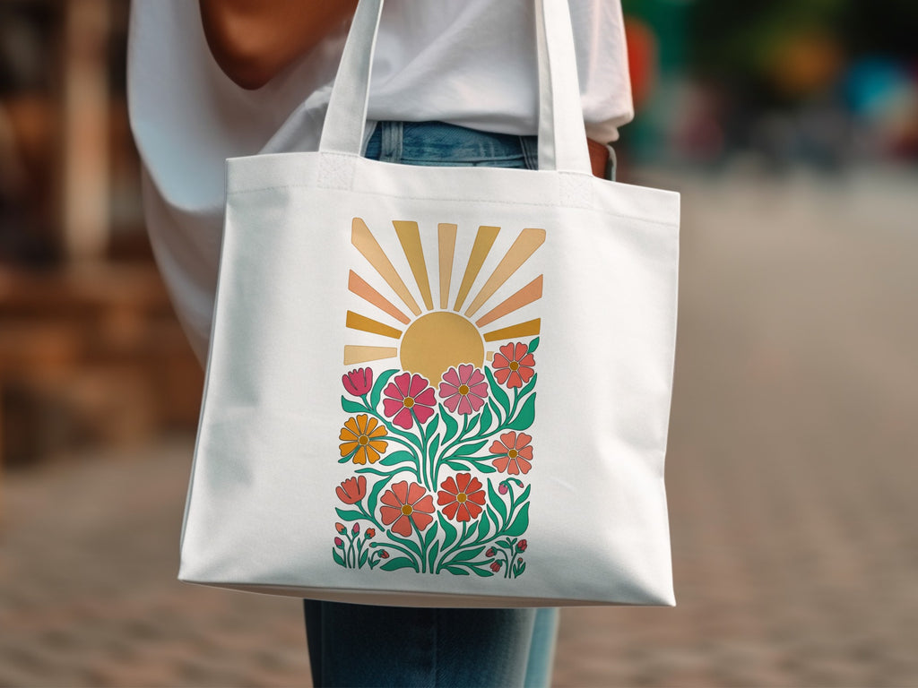 White canvas tote bag with colorful floral sunburst graphic design.