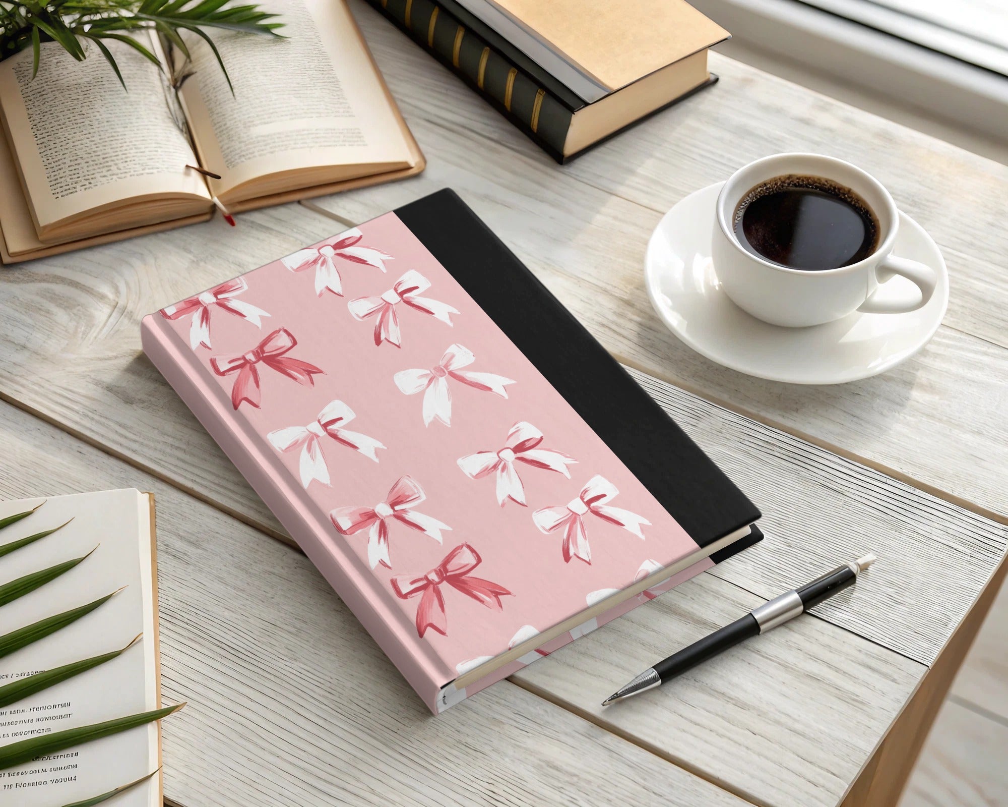 Pink and Black Notebook With White and Red Bow Designs