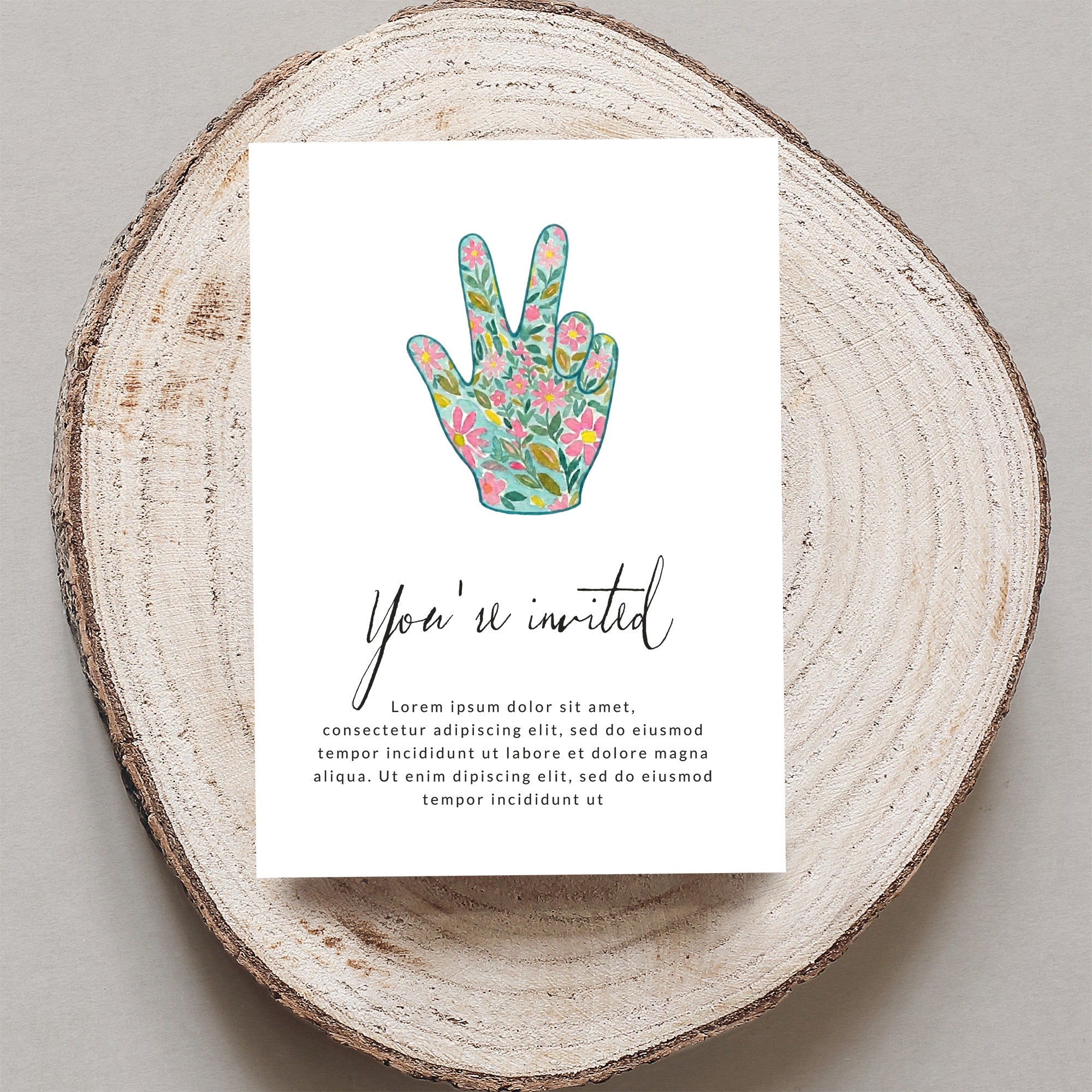 Invitation card with floral peace sign and placeholder text.