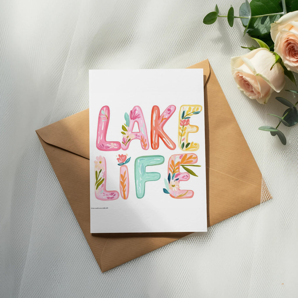 Card with "LAKE LIFE" in colorful, floral letters on a brown envelope.