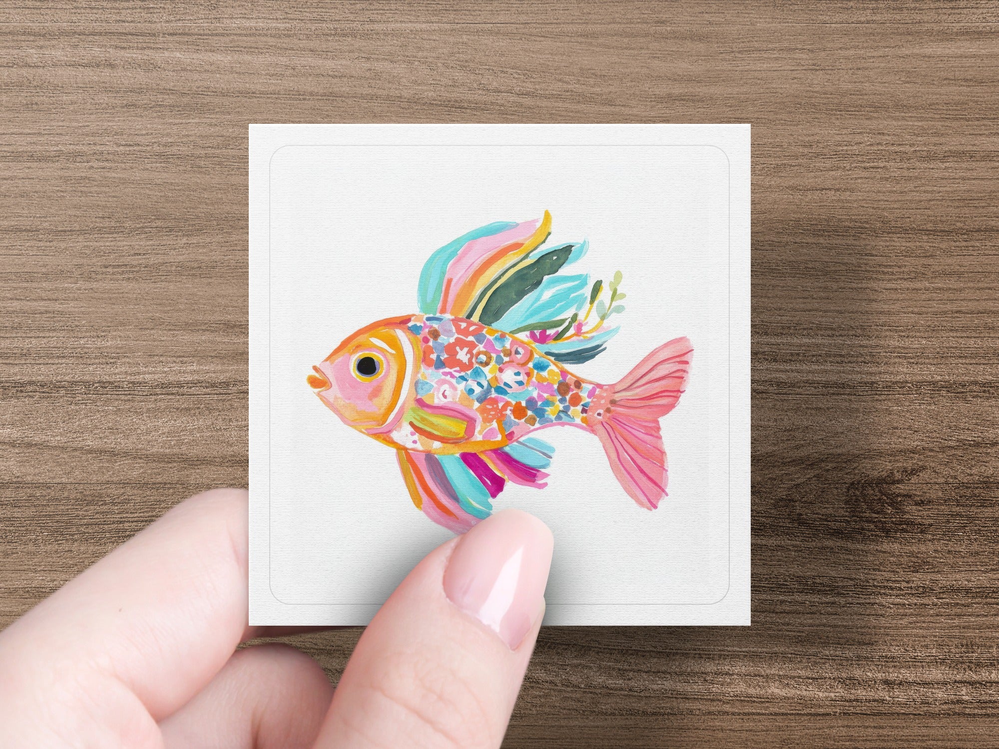 Square illustration of a colorful, stylized fish with floral accents.