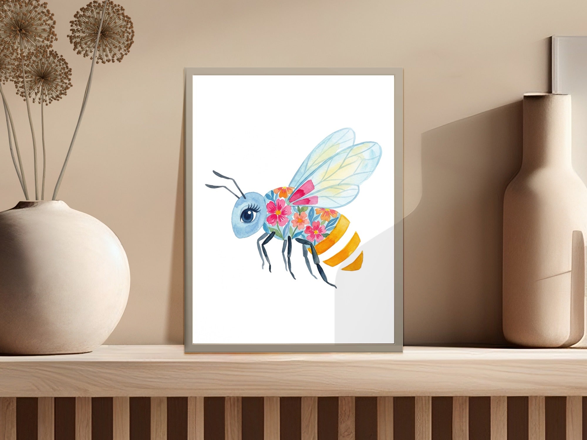 Watercolor painting of a bee with colorful floral wings on a wooden shelf.