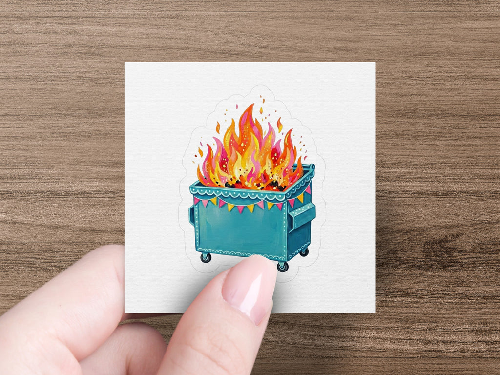 Blue dumpster fire sticker with festive garland.