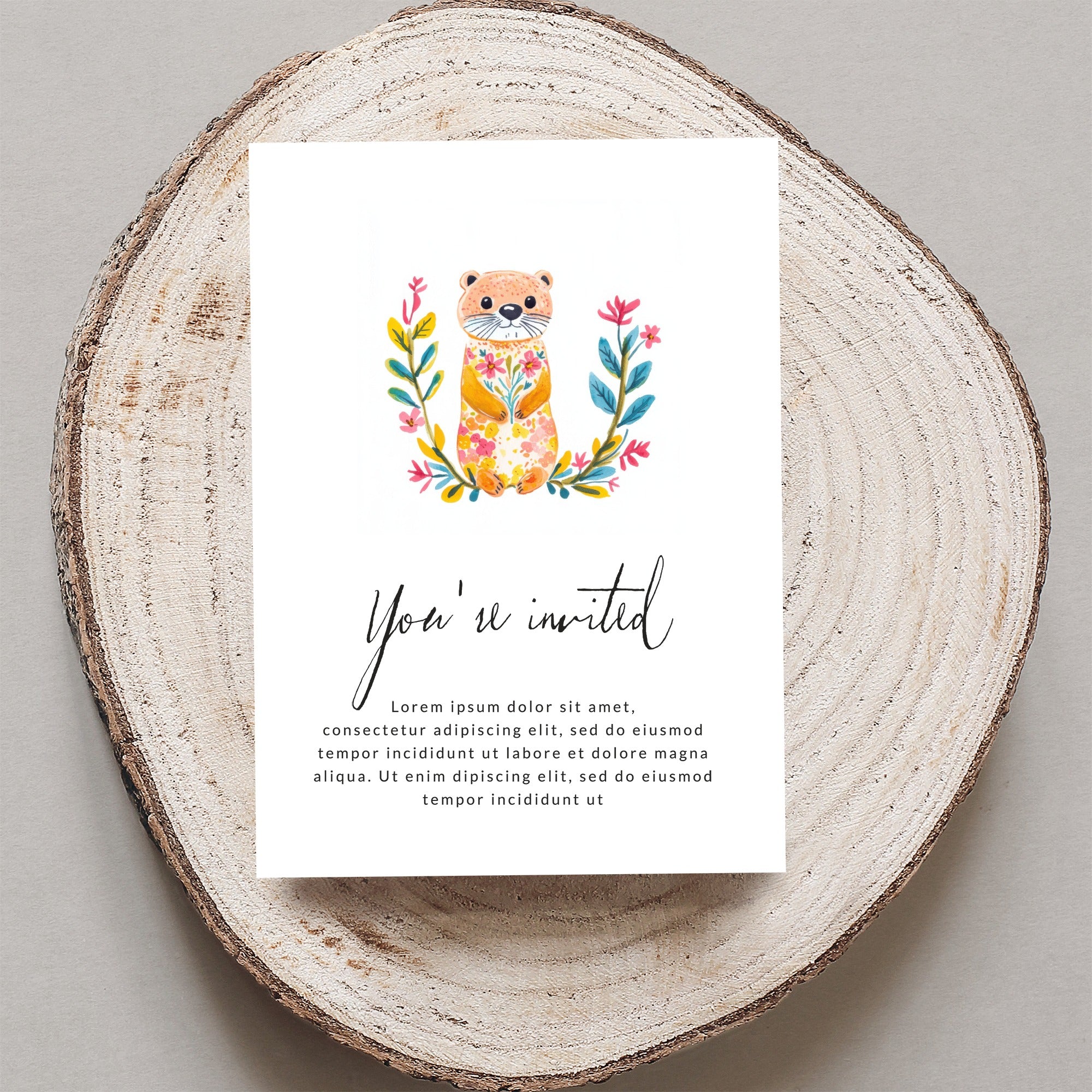 Invitation with watercolor otter and floral wreath, "You're invited" text.