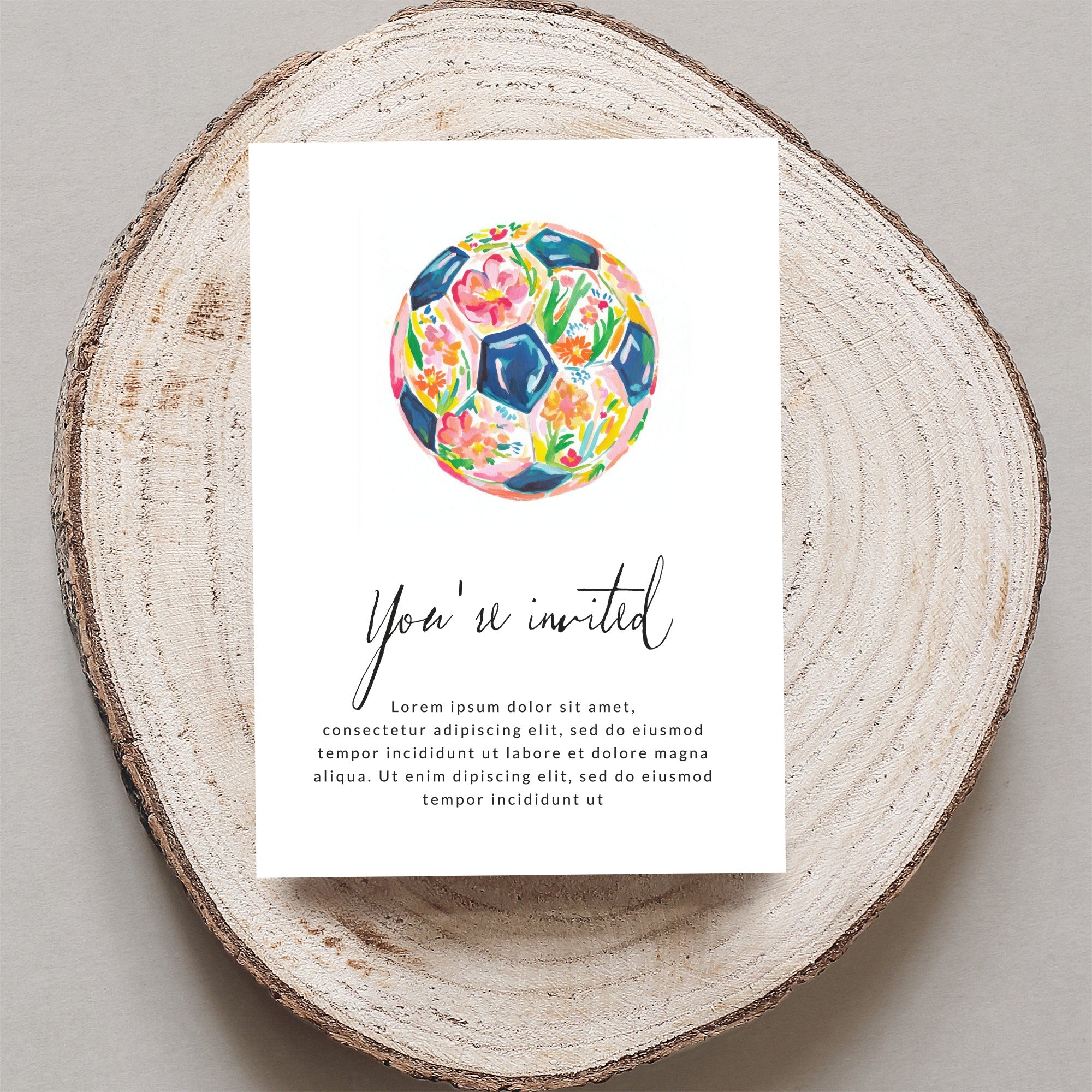 Invitation with floral soccer ball and placeholder text.