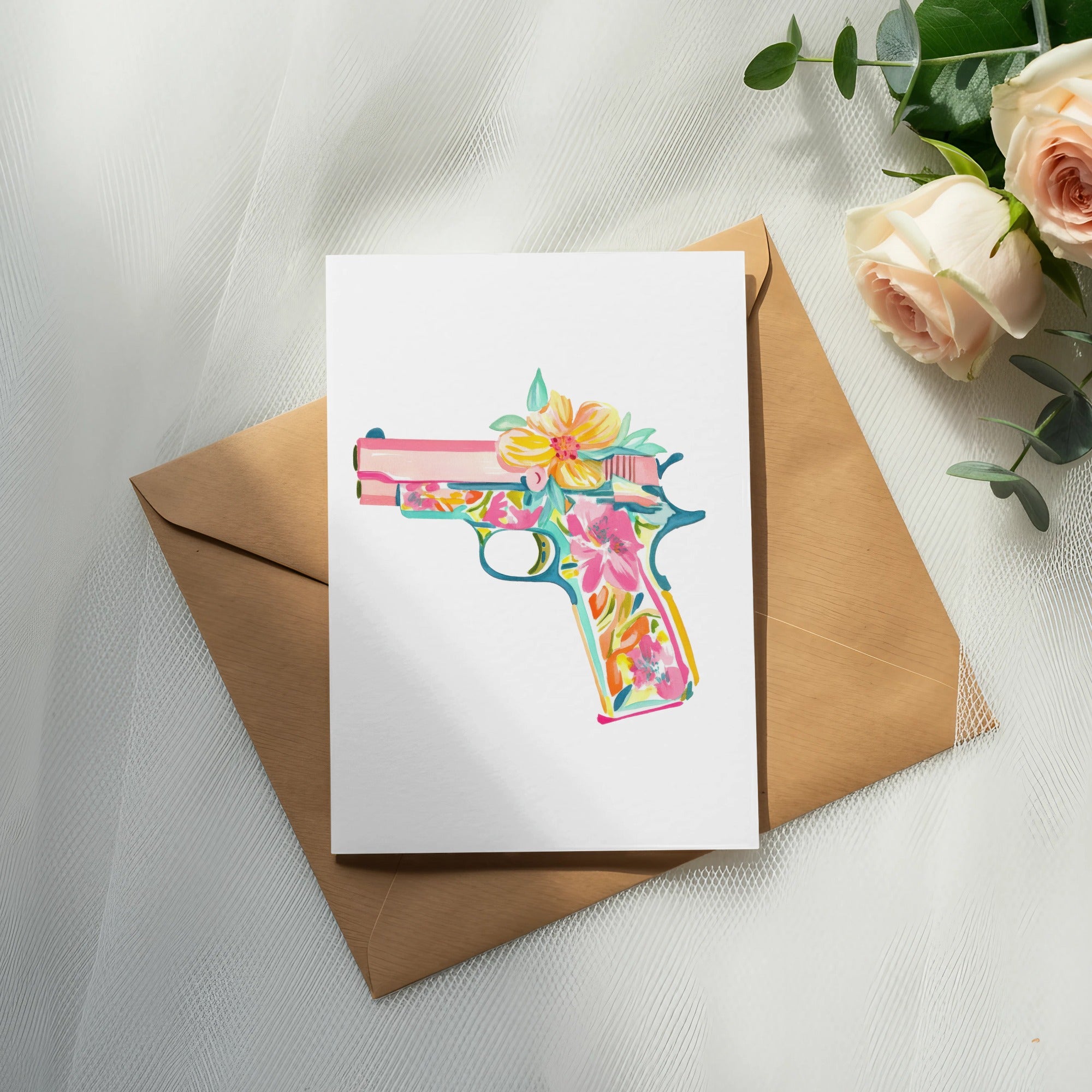 Card featuring a colorful floral pistol illustration on an envelope.