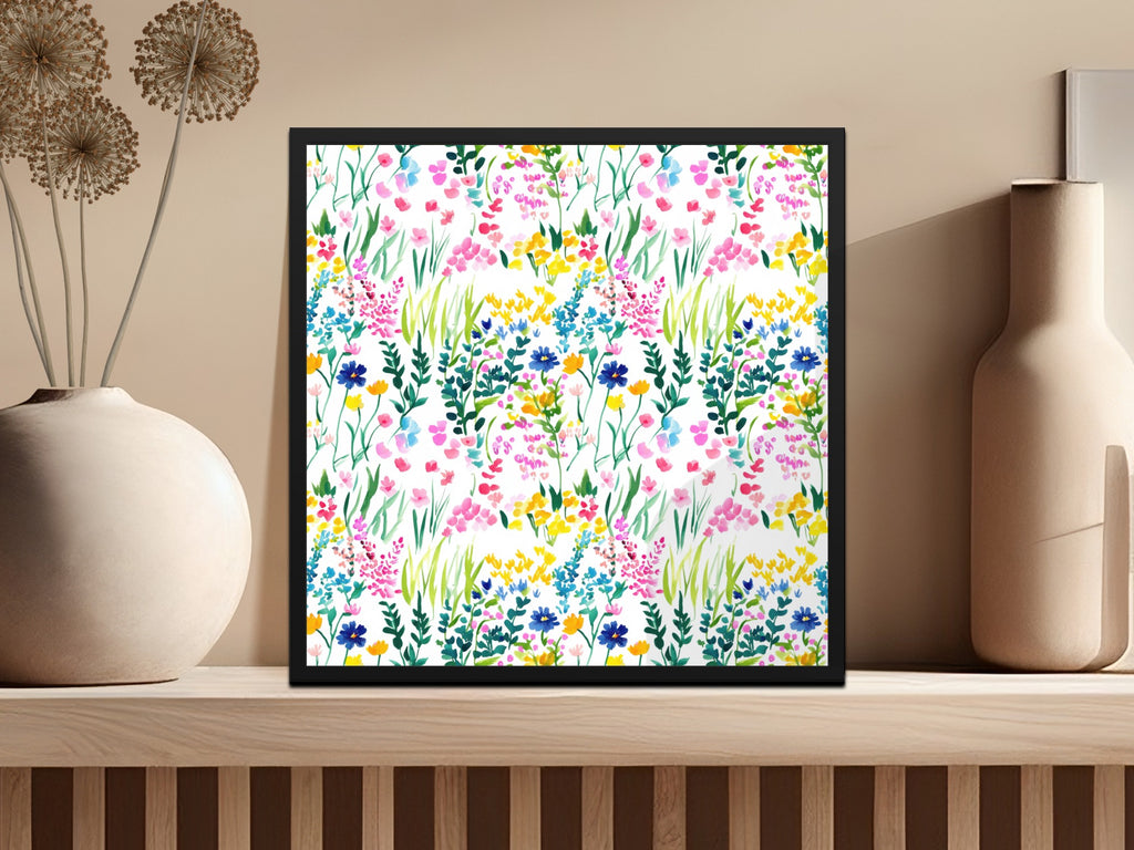 Framed floral watercolor print with pink, yellow, and blue wildflowers.