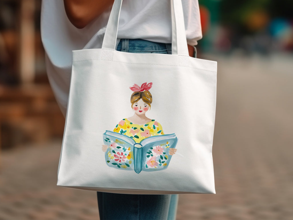 Woman in floral top holding open book with blooming flowers.
