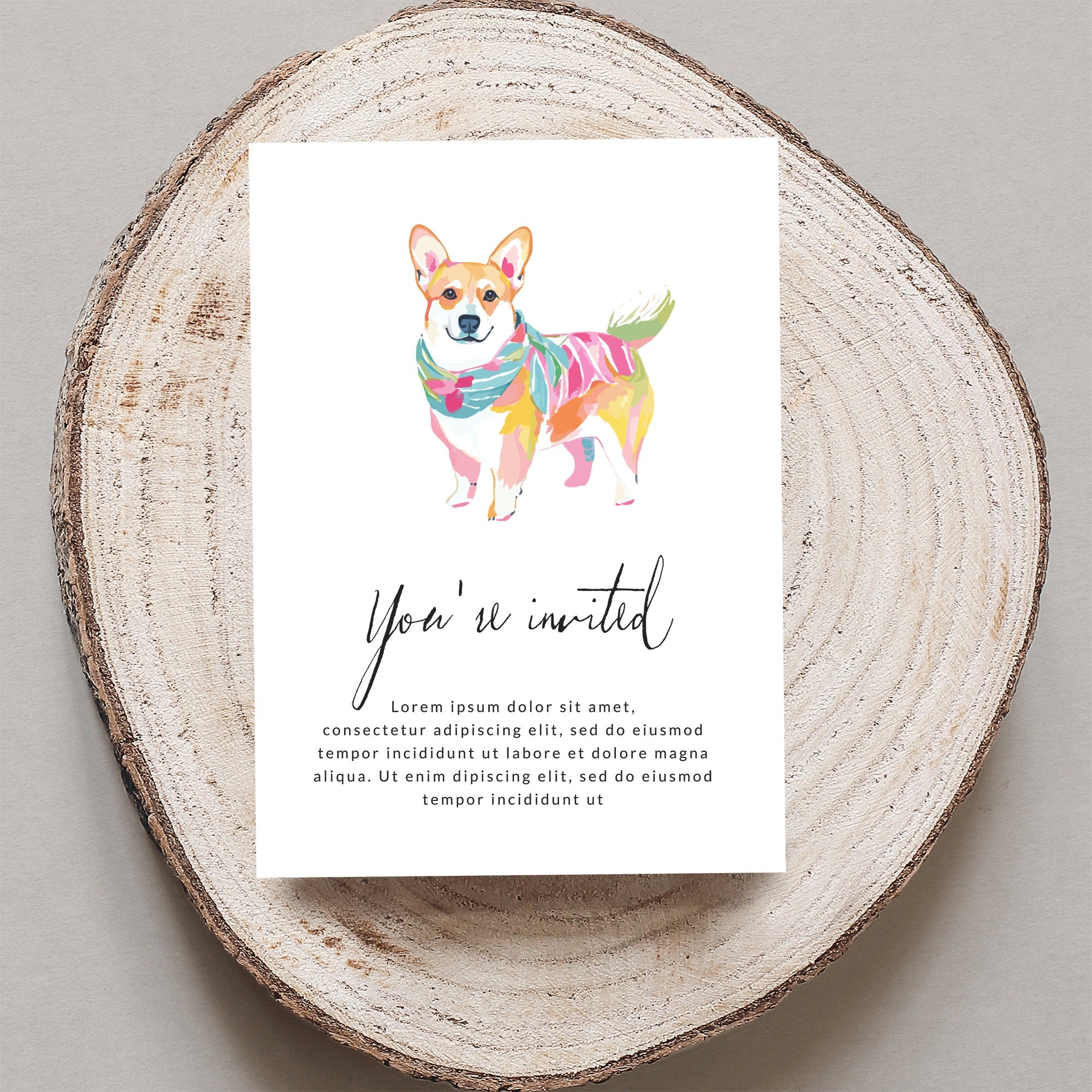 Corgi wearing a colorful scarf on an invitation with text.