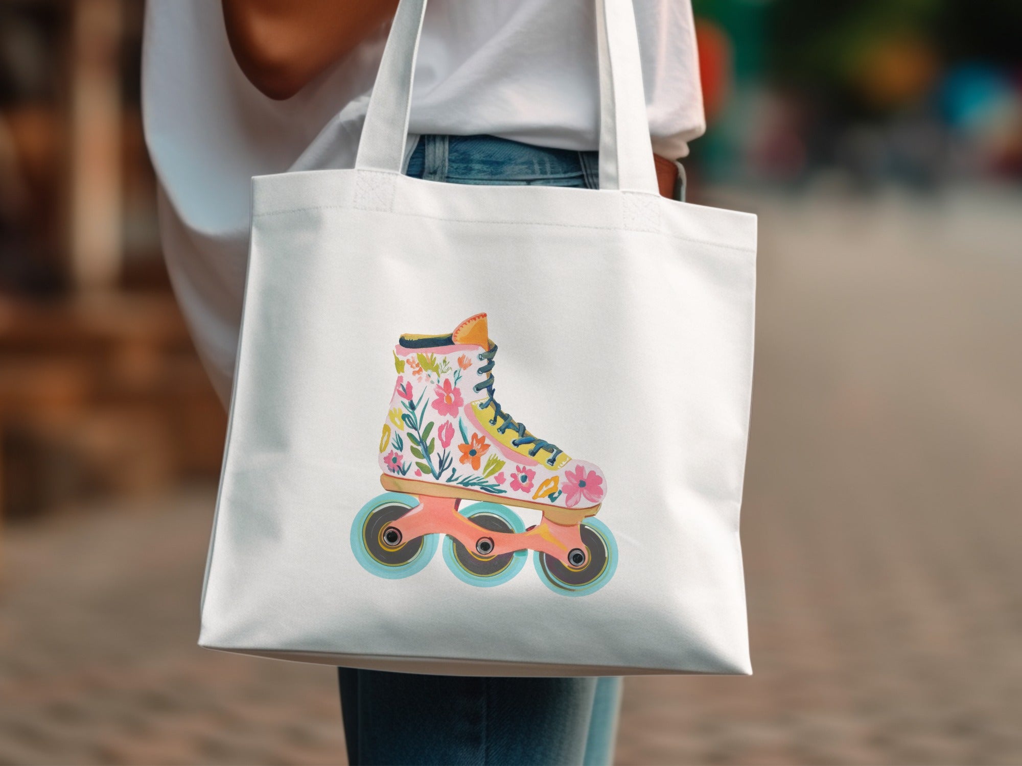 White tote bag with colorful floral roller skate illustration.