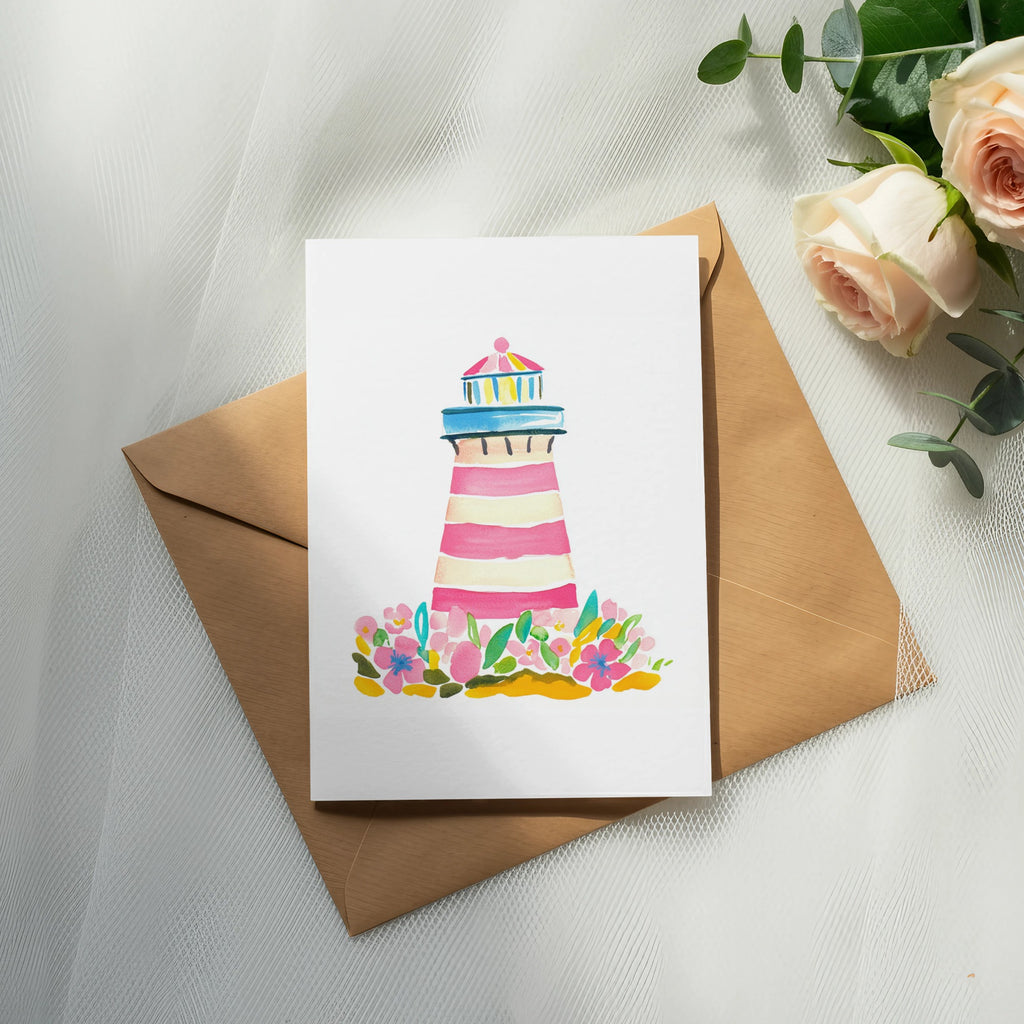 Watercolor lighthouse with pink stripes surrounded by flowers on a card.