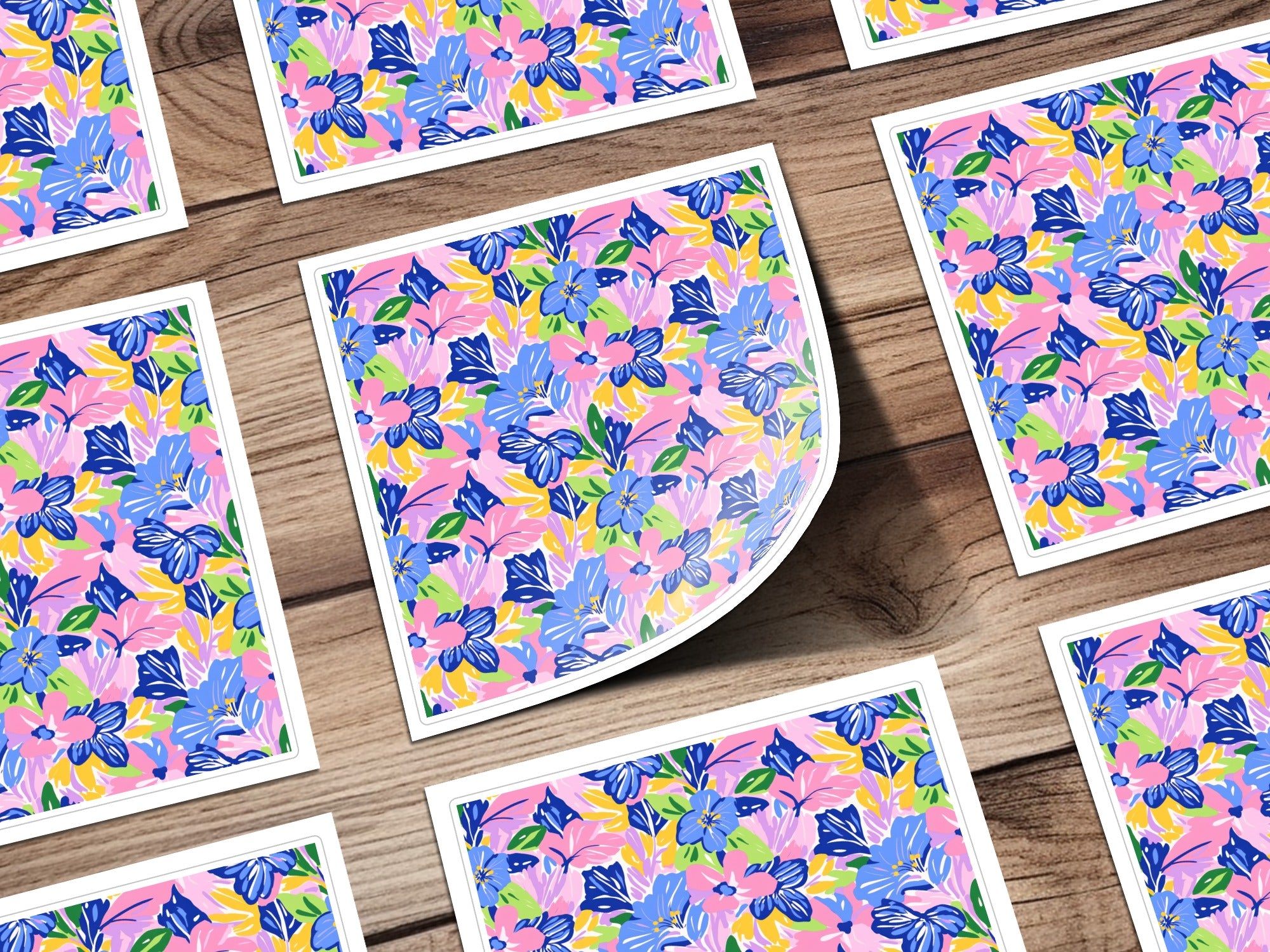 Floral pattern stickers on a wooden background.