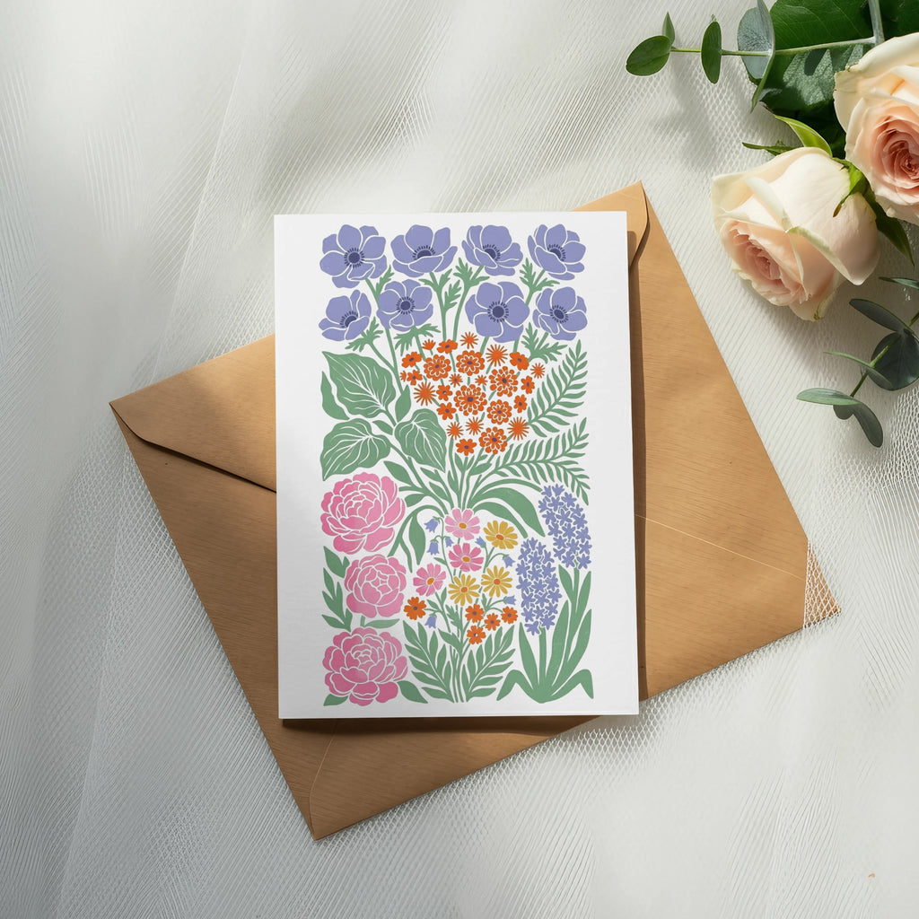 Floral greeting card with purple, pink, and orange flowers on a brown envelope.