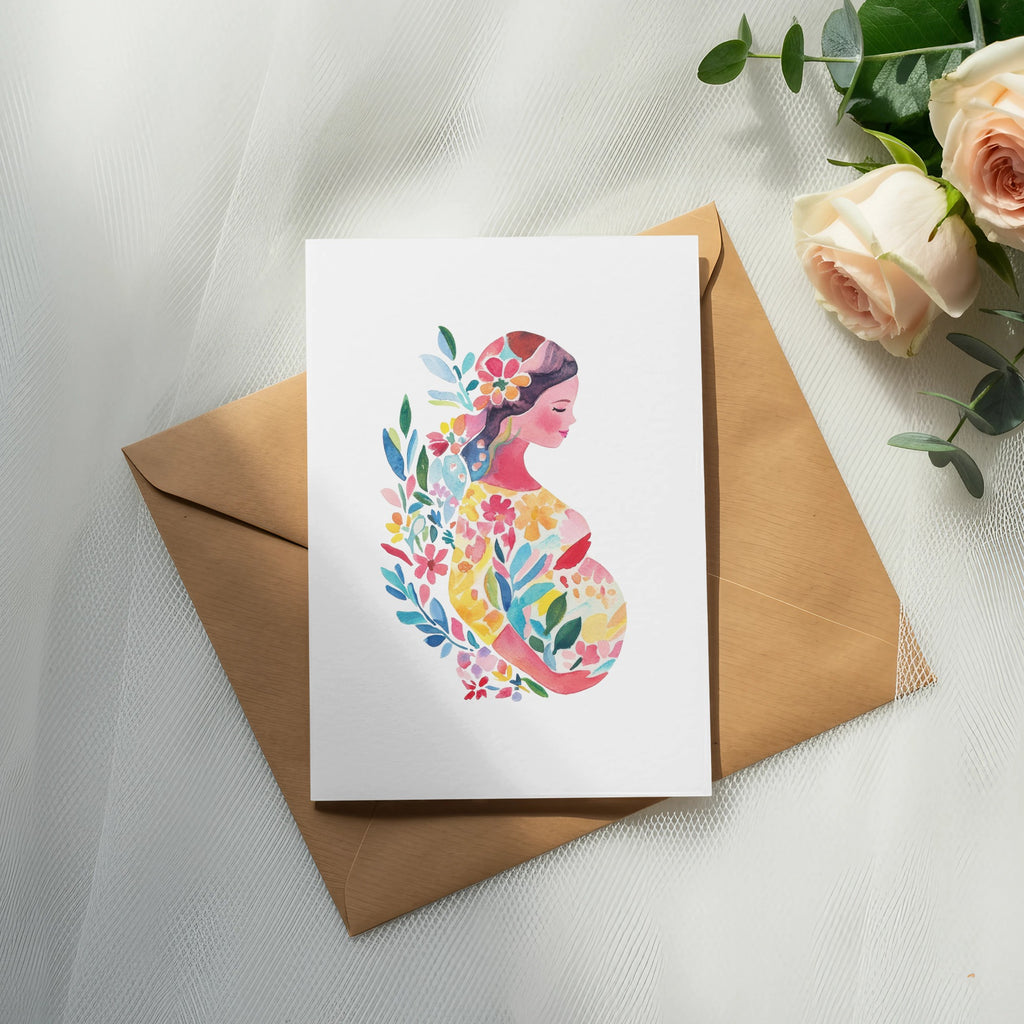 Watercolor illustration of a pregnant woman surrounded by colorful flowers on a card.