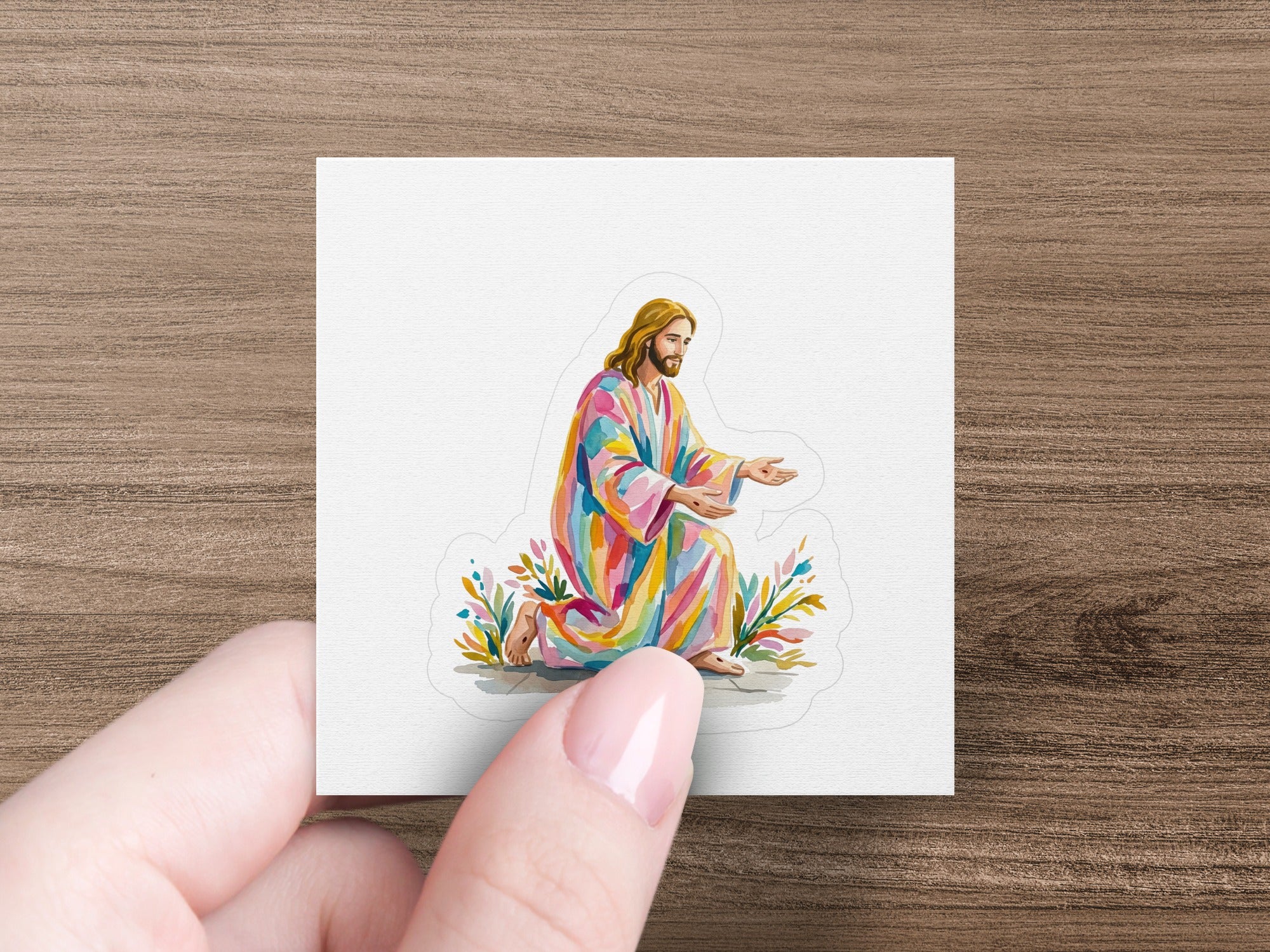 Jesus in colorful robes kneels with open arms, reaching out.