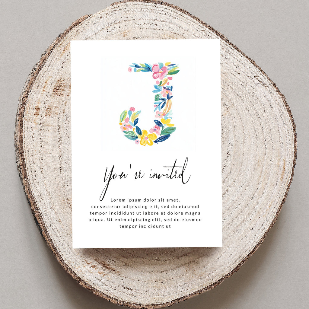 Floral letter J on invitation with "You're invited" text.