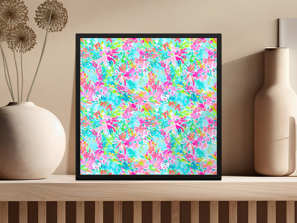 Framed colorful floral pattern on a shelf with vases.