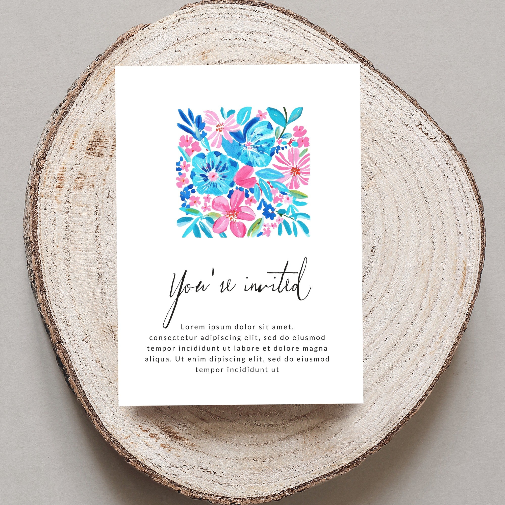 Invitation card with floral watercolor design and "You're invited" text.