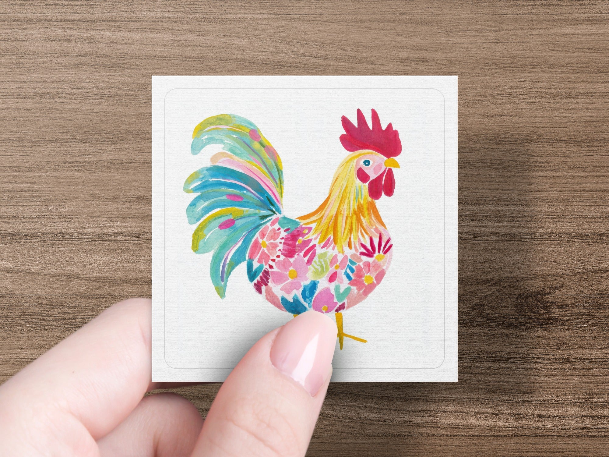 Watercolor rooster with colorful floral pattern on tail feathers.