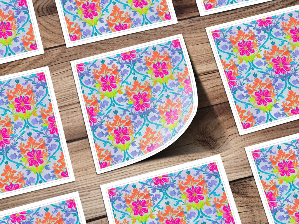 Floral pattern sticker with pink, orange, and blue flowers on wood background.