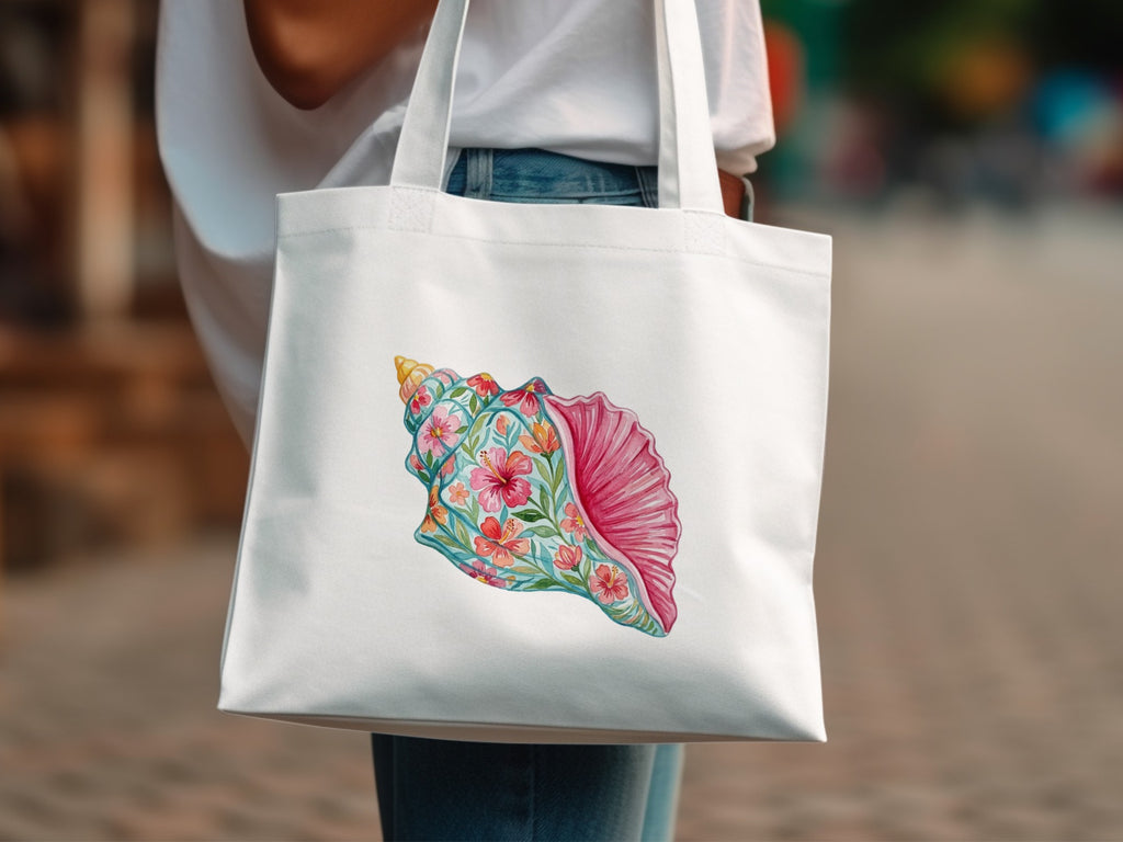White tote bag with a colorful floral seashell illustration.