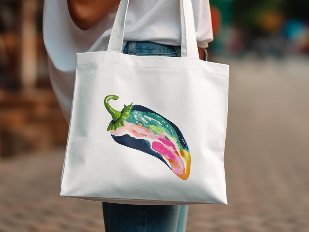 White tote bag with a colorful, abstract chili pepper illustration.